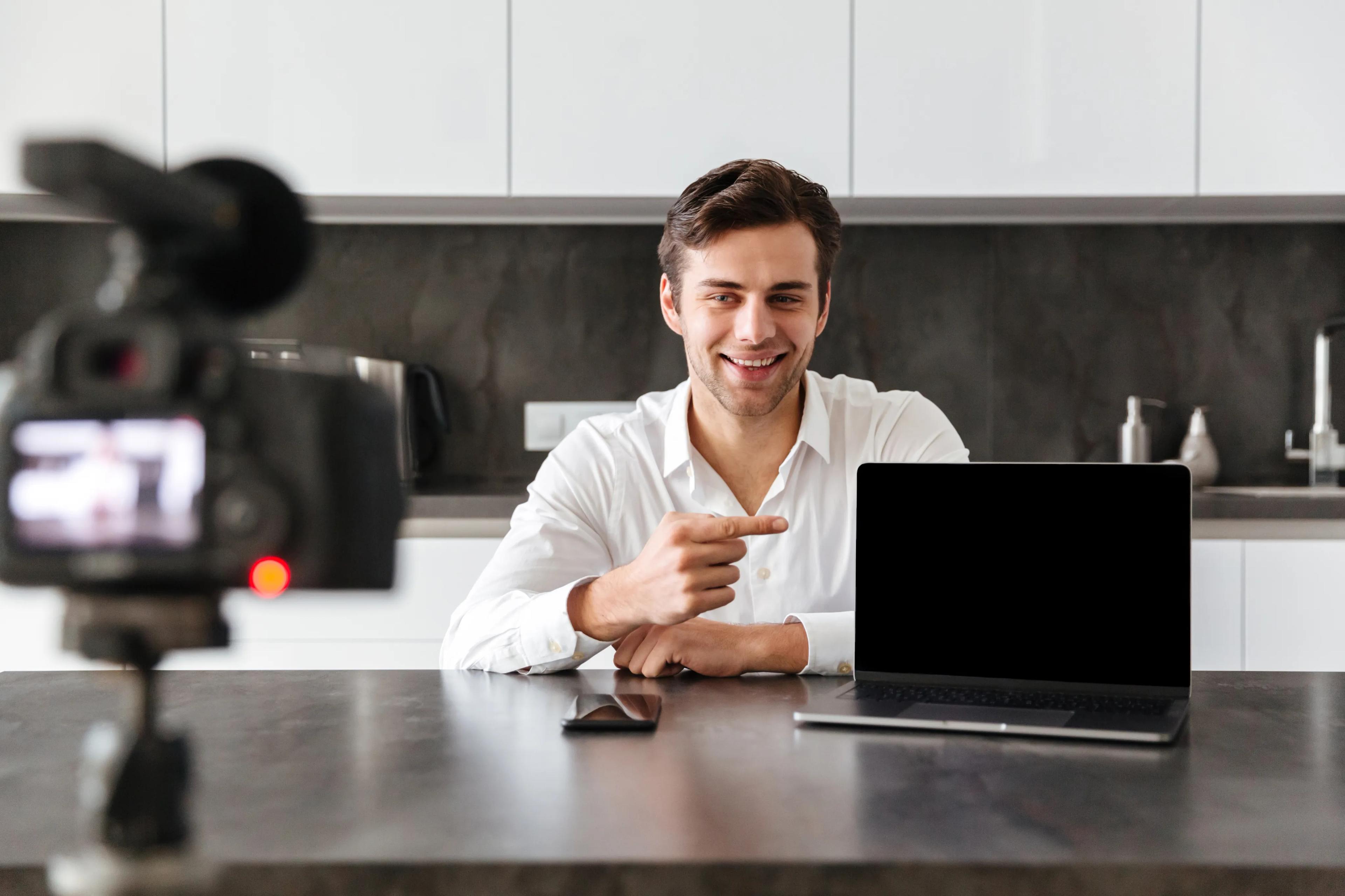 A creator sharing useful tools on his laptop