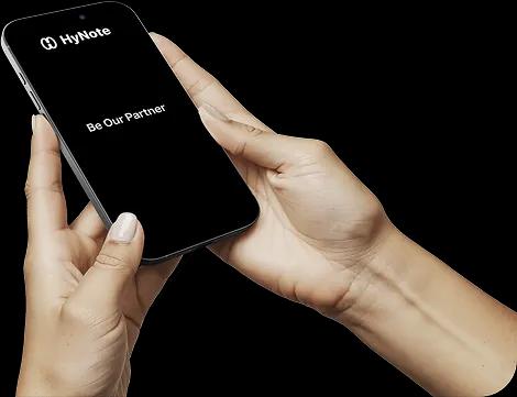 Hands holding a phone showing the HyNote Partner program